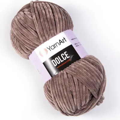 A ball of YarnArt Dolce chenille yarn in beige-gray.