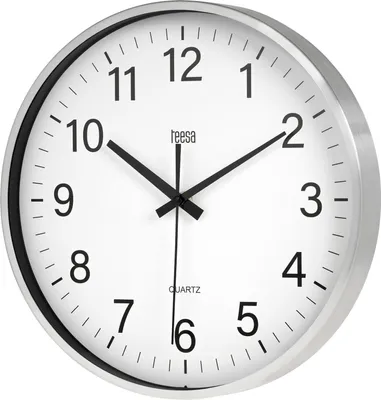 A close-up, studio shot of a silver analog wall clock with a white face and black numbers and hands.
