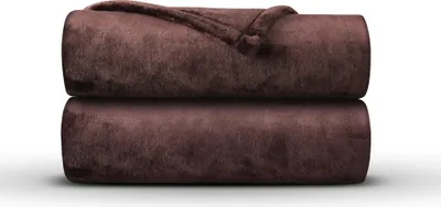 Two rolled-up blankets are stacked on top of each other against a white background.