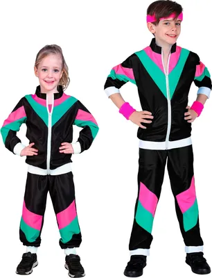Two children, a boy and a girl, are posing in matching retro-style tracksuits.