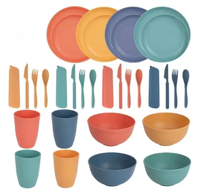 A collection of colorful plates, bowls, cups, and cutlery arranged in rows against a white background.