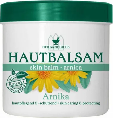 A product shot of a jar of skin balm with flowers on the label.