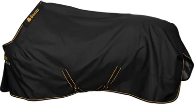A black horse blanket with gold trim is laid out on a white background.