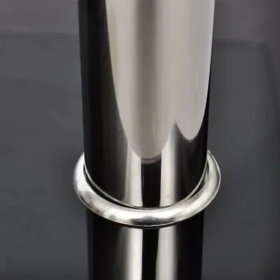 A close-up shot of a silver ring around the base of a cylindrical object, likely a table leg.
