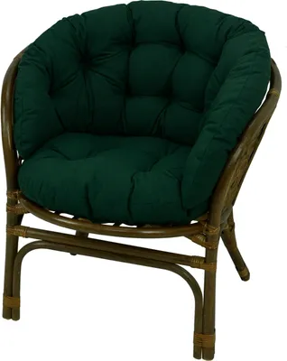 A green cushion on a rattan chair.