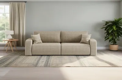 A living room scene with a sofa, rug, plant, and window.