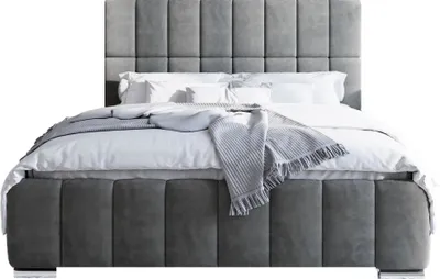 A studio shot of a bed.