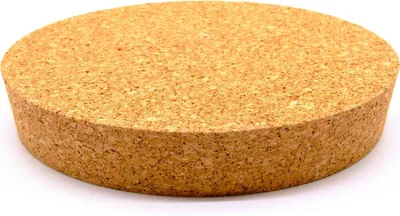 A round, tapered cork stopper on a white background.