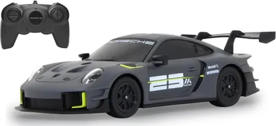 A remote-controlled Porsche 911 GT2 RS Clubsport 25 toy car and its remote control are displayed against a white background.