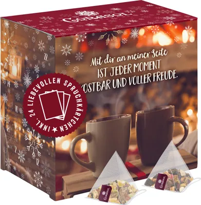 A festive box of tea with a winter theme, featuring two mugs of hot drinks and tea bags.