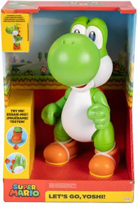 A toy Yoshi figure in its retail packaging, displayed against a backdrop that mimics a game environment.
