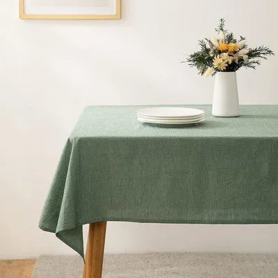 Imagen del producto de Mesa Unyqoos®, mantel rectangular, verde, aspecto de lino, 100% algodón prelavado, lavable a máquina hasta 60 °C, 1 unidad