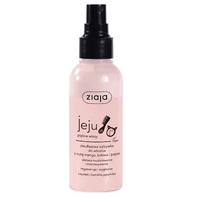 A pink spray bottle of hair conditioner with a black spray nozzle, set against a white background.