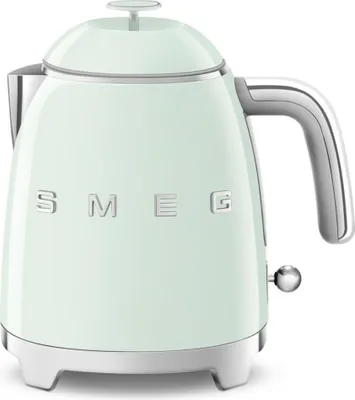 A pastel green Smeg mini kettle on a white background.