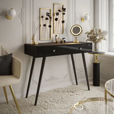 A modern vanity table setup with decorative elements and a chair.