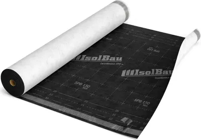 A roll of black underlayment material with white protective covering is partially unrolled on a white surface.
