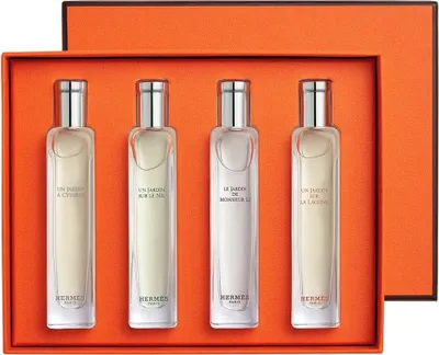 A set of four Hermès perfumes in a gift box.