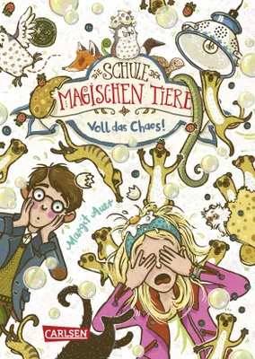 A colorful, illustrated cover of a children's book titled "Die Schule der magischen Tiere 12: Voll das Chaos!". It features cartoon characters of children and various animals in a chaotic, bubbly scene.