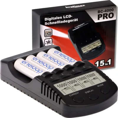 A Kraftmax BC-4000 Pro battery charger with four eneloop AA batteries inserted, shown with its packaging in the background.