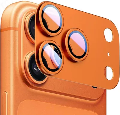 Close-up of an orange smartphone camera lens protector with three circular lenses.