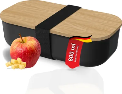 A lunchbox with an apple and cheese cubes.