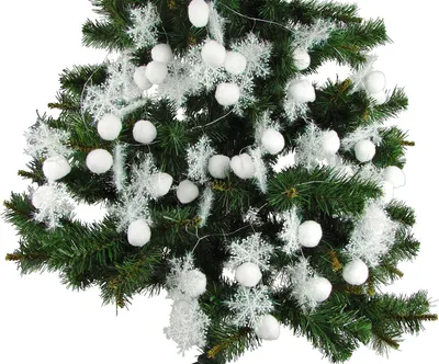 A close-up view of a decorated Christmas tree branch with white snowflake and snowball ornaments.