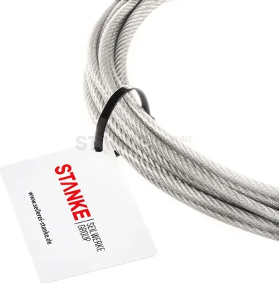 A coiled stainless steel wire rope with a PVC coating, featuring a product tag attached.
