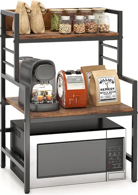A 3-tier kitchen rack with a microwave on the bottom shelf and various kitchen appliances and food items on the upper shelves.