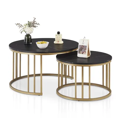Two round nesting coffee tables with black marble-effect tops and gold metal cage-like bases, displayed on a white background.