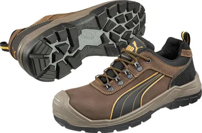 A pair of Puma safety shoes, one shown from the side and the other from the sole.