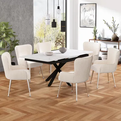 A dining room setting with a table and chairs.