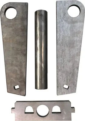 Several metal parts for a quick-change adapter are laid out on a white background.