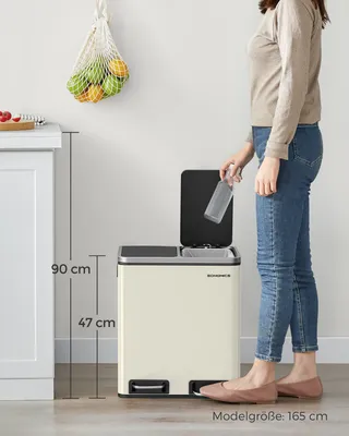 A person is shown using a dual-compartment kitchen trash can.