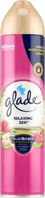 A Glade air freshener spray can with a floral and striped design.