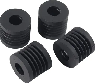 Four black rubber feet for a 3D printer.