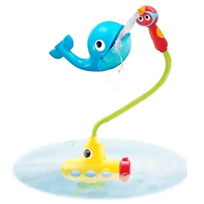 A bath toy featuring a yellow submarine and a blue whale spraying water.