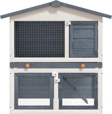 A front view of a two-tiered wooden rabbit hutch with wire mesh doors and a slatted window.