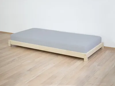 A simple bed frame with a mattress.