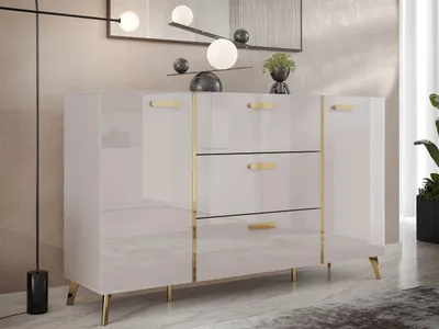 A modern, high-gloss white sideboard with gold accents, set in a well-lit room with a textured wall and marble-effect flooring.
