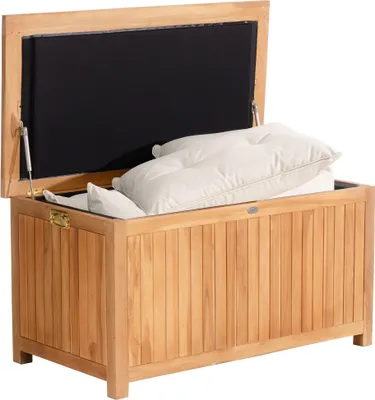 A teak storage box with its lid open, revealing white cushions inside. The box is made of vertical wooden planks and has a black interior lining.