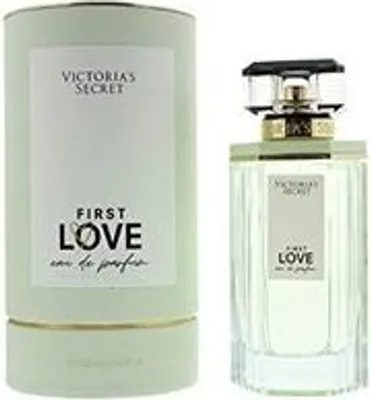 A bottle of Victoria's Secret First Love Eau de Parfum and its cylindrical packaging are displayed side-by-side against a white background.