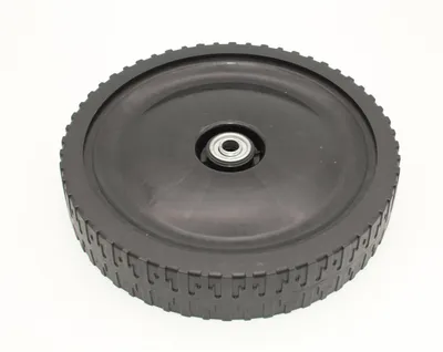 A black wheel with a bearing in the center, isolated on a white background.