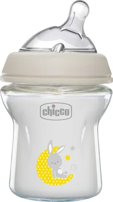 A baby bottle with a nipple and cap, filled with a white liquid. It has a graphic of a bunny on the moon with stars.