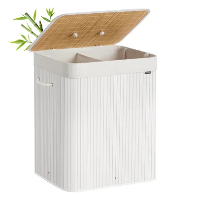 A white laundry basket with a bamboo lid and two compartments, with bamboo leaves in the top left corner.