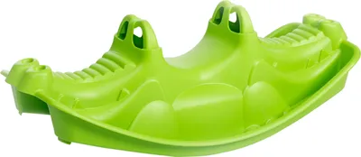 A bright green plastic seesaw shaped like a crocodile, isolated on a white background.