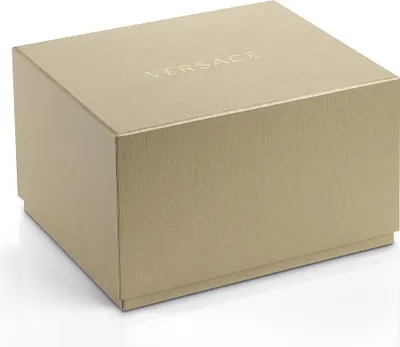 A closed, gold-colored gift box with the brand name embossed on the lid.