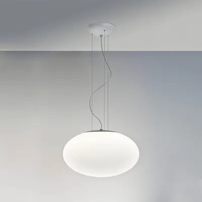 A white globe pendant light hanging from the ceiling.