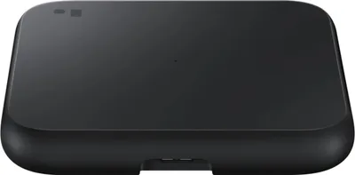 A black wireless charger pad is shown from a top-down perspective on a white background.