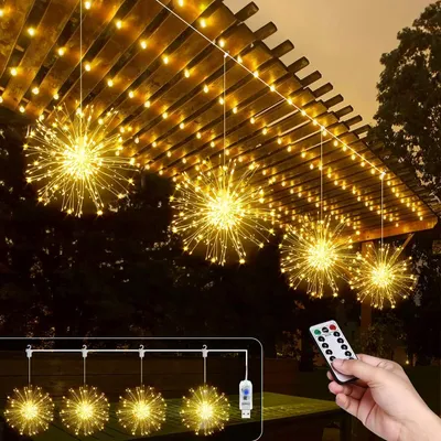 Outdoor patio with hanging starburst string lights and a remote control.