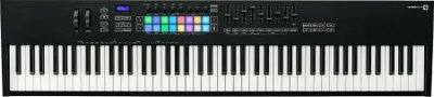 A top-down view of a black MIDI keyboard with white and black keys, and a control panel above the keys.